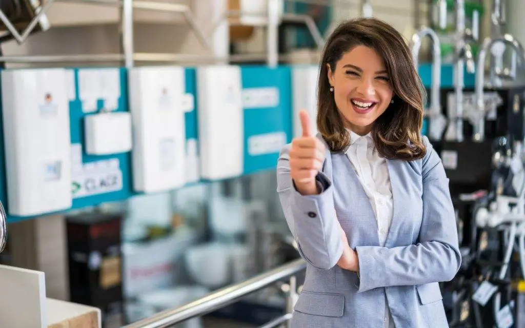 Does My Small Business Need A CPA? 5 A woman giving a thumbs up in a store - does my small business need a CPA